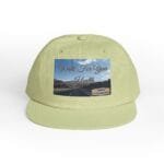 Cap with a patch reading 'Walk For Your Health' over a scenic road image; designer credit visible on the patch's bottom right.