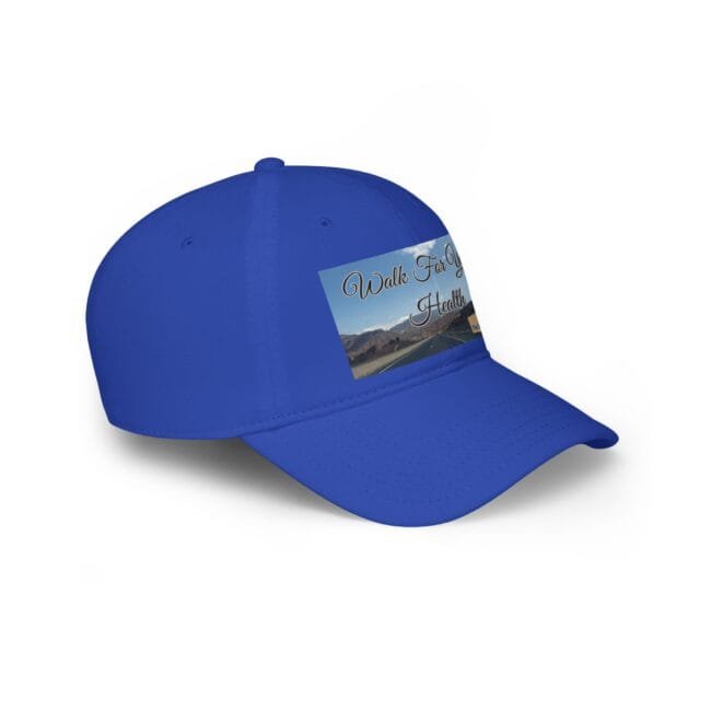 Blue baseball cap with a rectangular patch showing a scenic road through mountains and the text 'Walk For Health'.
