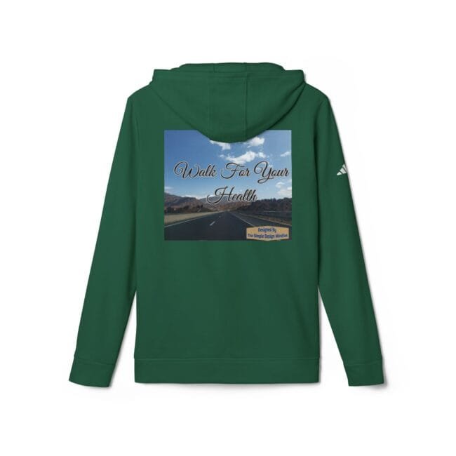 Green hoodie with a back print reading 'Walk For Your Health' over a highway landscape under a blue sky with mountains.