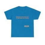 Blue t-shirt with an orange slogan inside a purple decorative frame: "BREATHE IN THE FRESH AIR TO EMPOWER YOUR ENERGY", plus a small beige designer label.