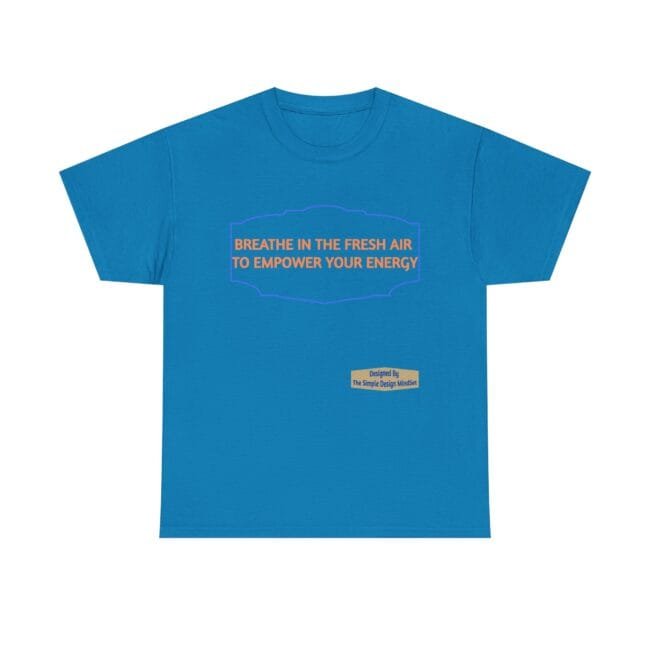 Blue t-shirt with an orange slogan inside a purple decorative frame: "BREATHE IN THE FRESH AIR TO EMPOWER YOUR ENERGY", plus a small beige designer label.