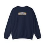 Navy sweatshirt with a small tan label on the upper back reading 'Designed By The Simple Design MindSet'.