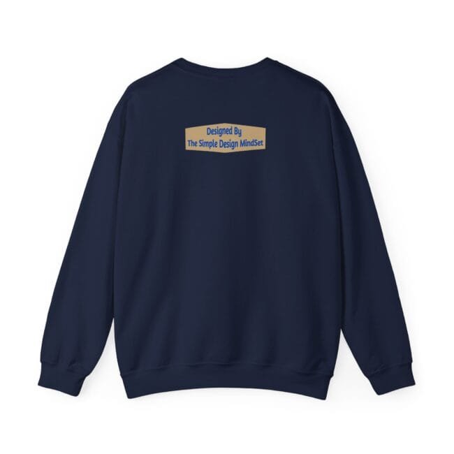 Navy sweatshirt with a small tan label on the upper back reading 'Designed By The Simple Design MindSet'.