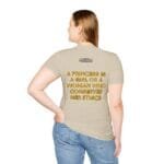 Back view of a beige T-shirt worn by a woman; slogan reads: 'A PRINCESS IS A GIRL OR A WOMAN WHO CONSERVES HER ETHICS'.