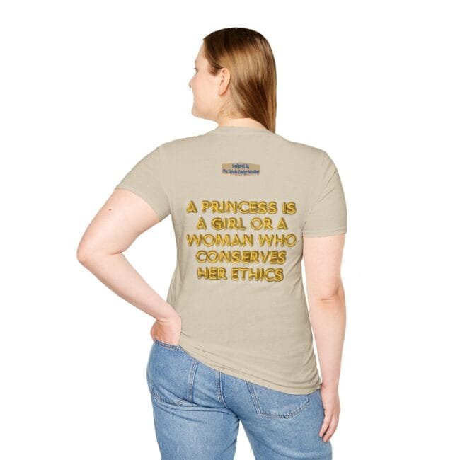 Back view of a beige T-shirt worn by a woman; slogan reads: 'A PRINCESS IS A GIRL OR A WOMAN WHO CONSERVES HER ETHICS'.