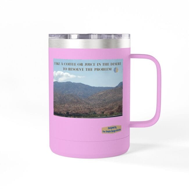 Pink insulated tumbler with a desert landscape image and a motivational slogan about coffee or juice in the desert.