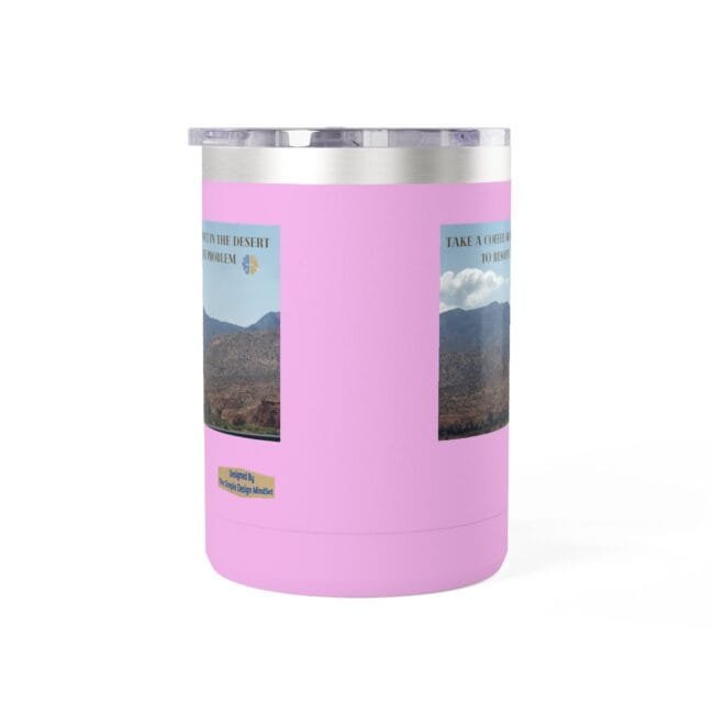Pink cylindrical tumbler with a clear lid and landscape posters on its sides, featuring desert mountains.