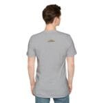 Back view of a heather gray t-shirt worn by a person, featuring a small blue-and-yellow label centered on the upper back.