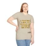 Woman in a beige T-shirt with gold 3D text reading, "A princess is a girl or a woman who conserves her ethics," standing with one hand on hip and smiling.