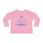 Pink long-sleeve shirt with blue text: 'Take care of my parents' and winking emojis, shown from back view.