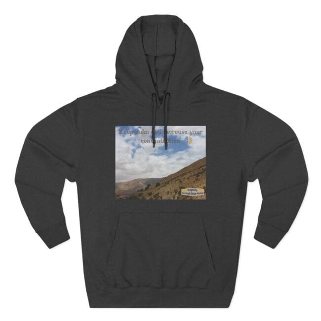 Dark gray hoodie with a square landscape print on the chest showing hills and a blue sky, overlaid with the words 'Keep calm and increase your concentration'.