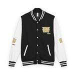 Black varsity jacket with white sleeves, striped cuffs and collar, snap buttons, and gold-printed phrase patches on chest and sleeves (reads: 'A PRINCESS IS A GIRL OR A WOMAN WHO CONSERVES HER ETHICS').