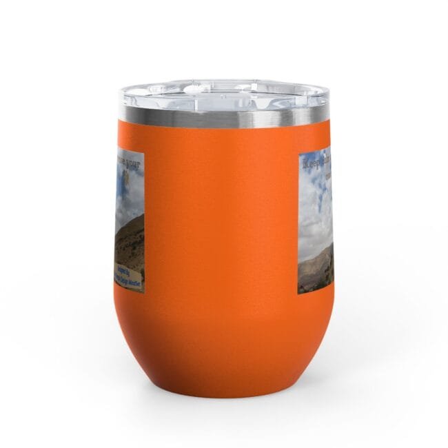 Orange insulated tumbler with a clear lid and a textured orange wrap featuring two landscape photo stickers on the sides.