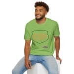 Man in a bright green t-shirt sitting on a white block, shirt reads 'KEEP CALM AND DON'T DISTURB MY HEAD PLEASE!'