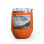 Orange insulated tumbler with a scenic hillside photo and the caption 'Keep calm and increase your concentration' on a sticker-like label.