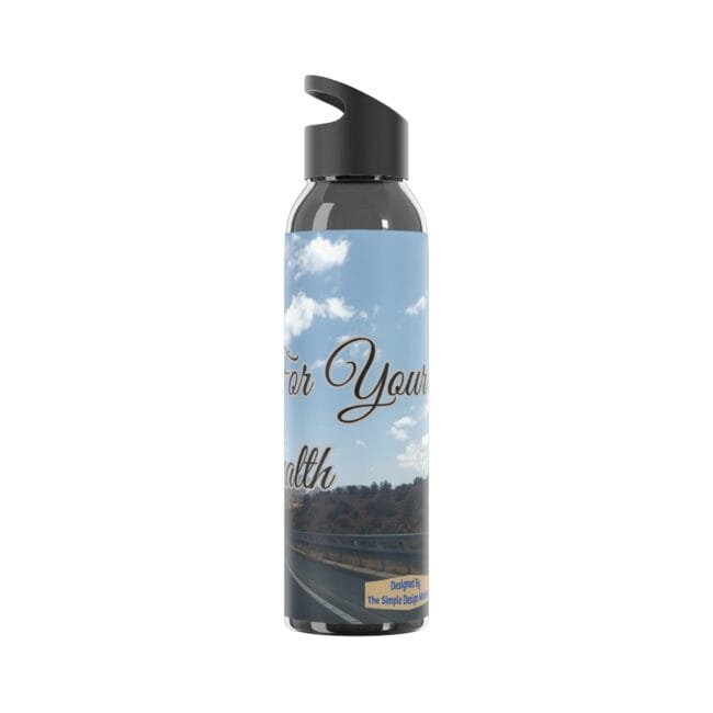 Reusable water bottle with a blue sky label reading 'For Your Health' and a highway scene in the background, black spout lid nearby.