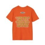 Orange T-shirt with bold gold 3D text: 'A PRINCESS IS A GIRL OR A WOMAN WHO CONSERVES HER ETHICS' on the back, plus a small brand label above.