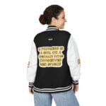 Back view of a woman wearing a black varsity jacket with white sleeves; gold text on the back reads: 'A princess is a girl or a woman who conserves her ethics'.
