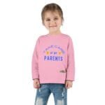 Smiling young girl in a pink sweatshirt with the slogan 'Take care of my parents' in blue text on the front.