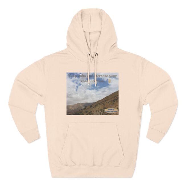 Beige hoodie featuring a square landscape graphic of mountains and sky with the text 'Keep calm and increase your concentration'.