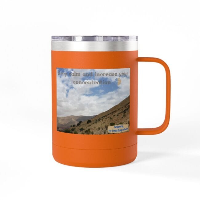 Orange insulated tumbler with a landscape sticker and the quote 'Keep calm and increase your concentration.'