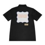 Black polo with a pastel scalloped frame on the back displaying the message 'Continuous learning is improving your culture's mindset' in orange letters, plus a small beige tag reading 'Designed by The Simple Mindset'.