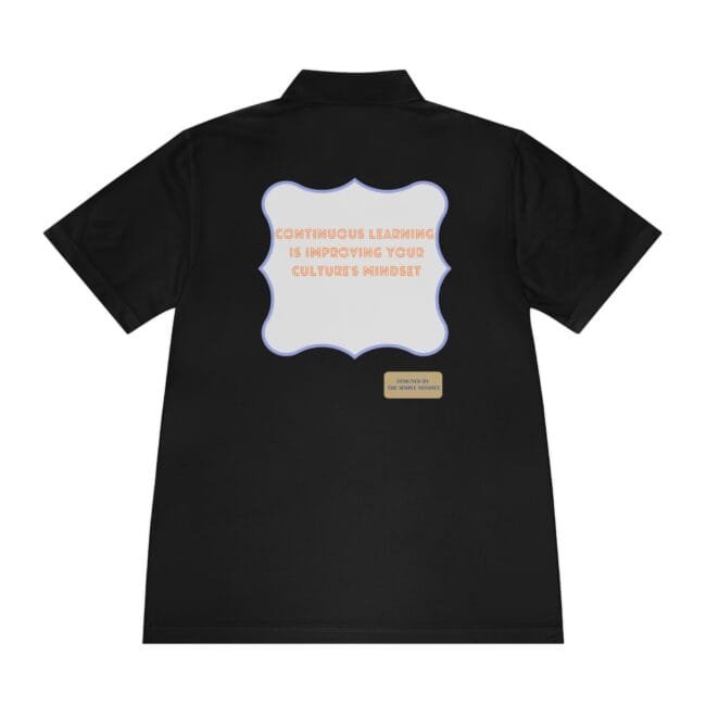 Black polo with a pastel scalloped frame on the back displaying the message 'Continuous learning is improving your culture's mindset' in orange letters, plus a small beige tag reading 'Designed by The Simple Mindset'.