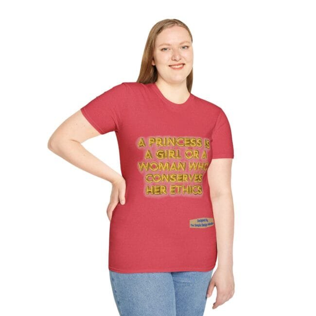 Woman wearing a red T-shirt with gold text: 'A PRINCESS IS A GIRL OR A WOMAN WHO CONSERVES HER ETHICS' and a small label at the hem area.