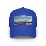 Blue baseball cap with a rectangular graphic that says "Walk For Your Health" over a road and mountains scene, plus a small blue-yellow designer note on the right.