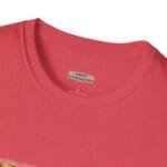Close-up of a pink heathered T-shirt neckline with an inner tag that reads 'Designed By The Simple Design MindSet'.