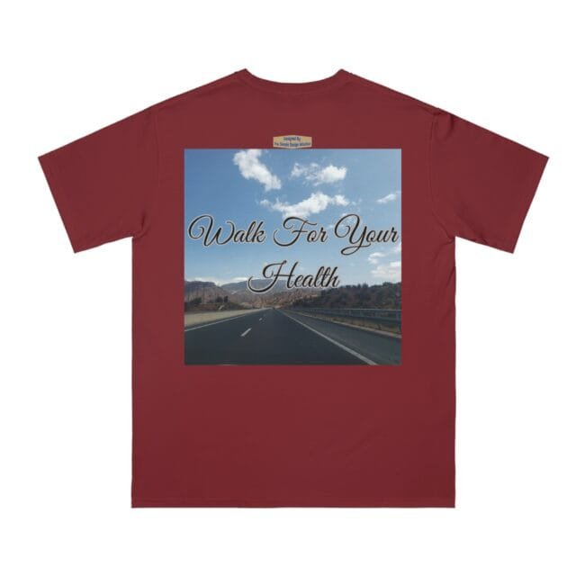 Maroon T‑shirt with a square graphic: an open highway toward mountains under a blue sky and the script 'Walk For Your Health' across it.