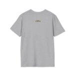 Light gray T-shirt viewed from the back with a small orange tag at the upper center back near the neck containing blue text.