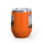 Orange insulated tumbler with a brushed metal rim and two landscape photo stickers on the side.