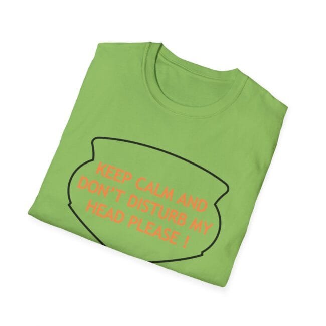 Light-green T-shirt folded with a speech-bubble outline and orange text: 'KEEP CALM AND DON'T DISTURB MY HEAD PLEASE!'