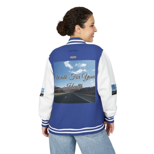 Back view of a blue and white varsity jacket with a large graphic on the back reading 'Walk For Your Health' over a road scene.