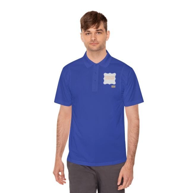 Young man wearing a royal blue polo shirt with a white badge patch on the left chest.