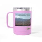 Pink insulated travel mug with a desert landscape image and the caption: 'Take a coffee or juice in the desert to resolve the problem.' Small designer label is visible in the corner, set against a pink body.