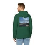 Back view of a man wearing a green hoodie with a graphic on the back showing a highway and blue sky with the text 'Walk For Your Health'.