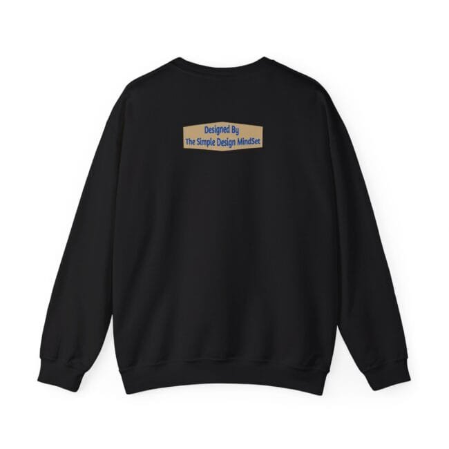 Back view of a black sweatshirt with a small beige rectangular patch reading 'Designed By The Simple Design MindSet'.