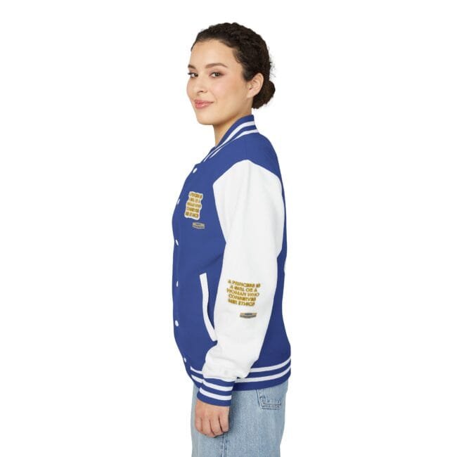 Woman in a blue and white varsity jacket with patches, shown in profile against a white background.