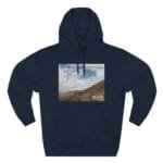 Navy hoodie with a rectangular landscape print of hills and a cloudy blue sky on the chest area.