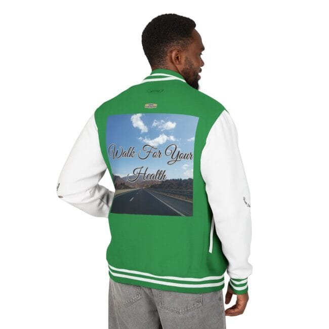 Back of a green and white varsity jacket featuring a graphic of an open road under a blue sky and the text 'Walk For Your Health'.
