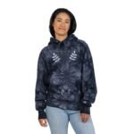 Woman wearing a navy tie-dye hoodie with 'Walk For Your Health' and laurel embroidery, standing in light jeans.