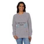 Woman modeling a gray crewneck sweatshirt that reads 'Walk For Your Health' with teal leaf embroidery on the sides.