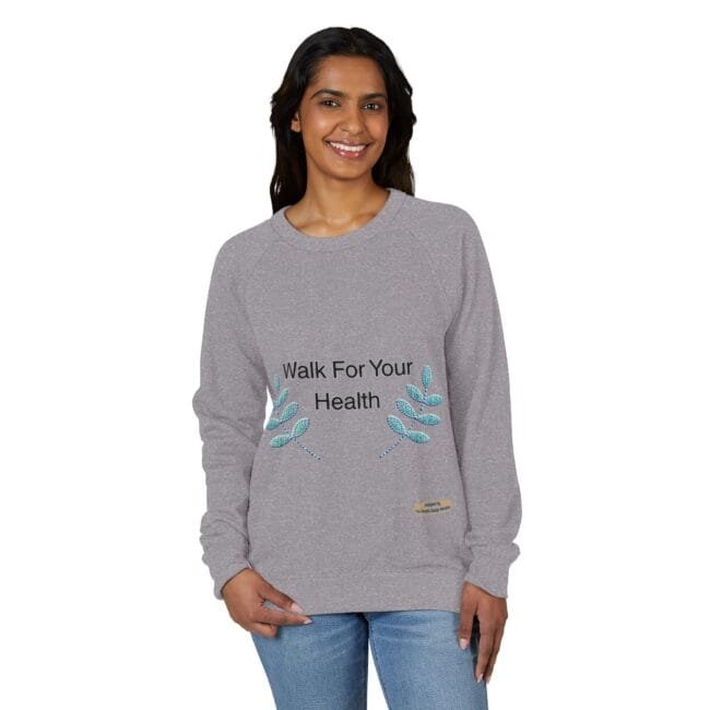 Woman modeling a gray crewneck sweatshirt that reads 'Walk For Your Health' with teal leaf embroidery on the sides.