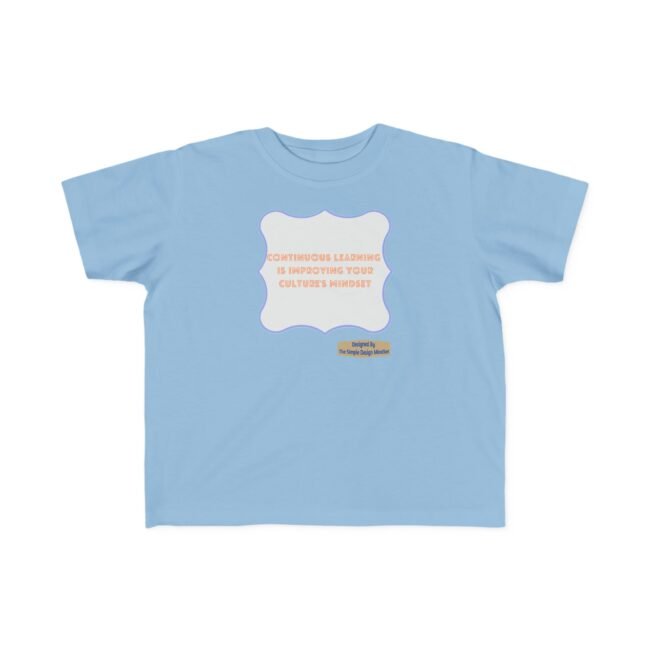 Light blue T-shirt with a centered white ornamental label showing orange text: 'Continuous learning is improving your culture's mindset' and a small designer badge below-right.