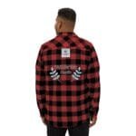 Back view of a person in a red-and-black plaid shirt with an embroidered 'Walk For Your Health' message and decorative blue leaves on the back.