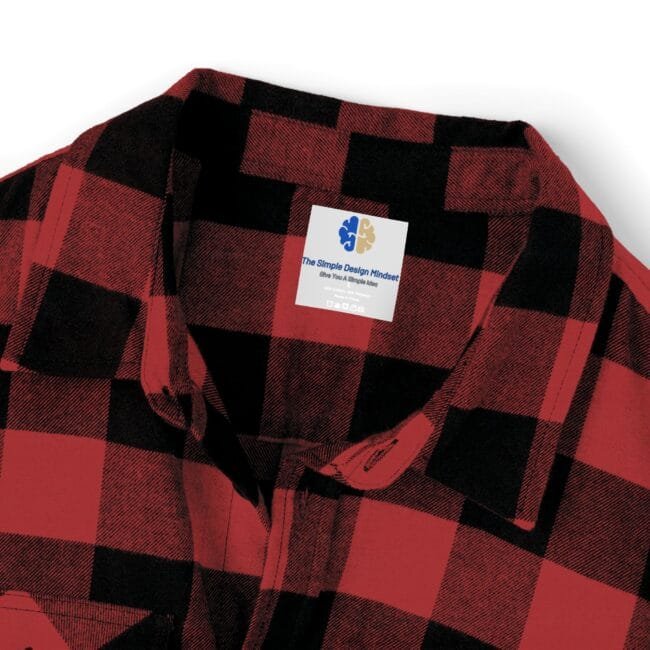Red and black plaid flannel shirt collar with a white square brand tag on the chest area.