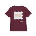 Maroon T-shirt with a light blue scalloped patch on the back containing orange text: 'CONTINUOUS LEARNING IS IMPROVING YOUR CULTURE'S MINDSET' and a small yellow label near the bottom edge.