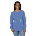 Woman in a blue sweatshirt with the slogan 'Walk For Your Health' and teal leaf embroidery on the front.